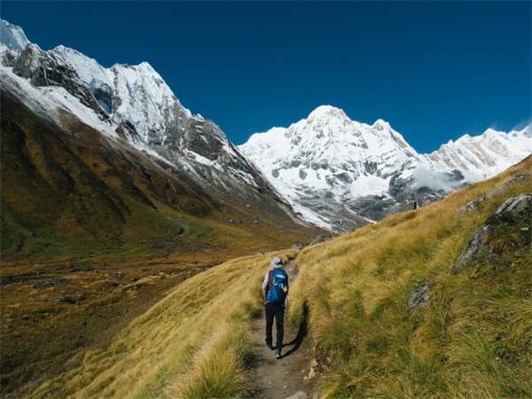 Helicopter flying over Annapurna Base Camp with panoramic Himalayan views